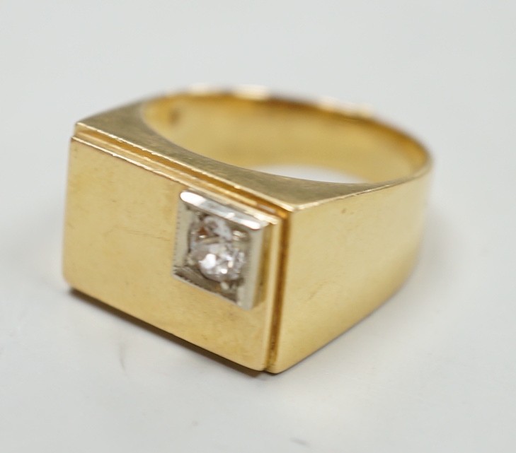 A 750 yellow metal and single stone diamond set signet ring, size Q/R, gross weight 10 grams.